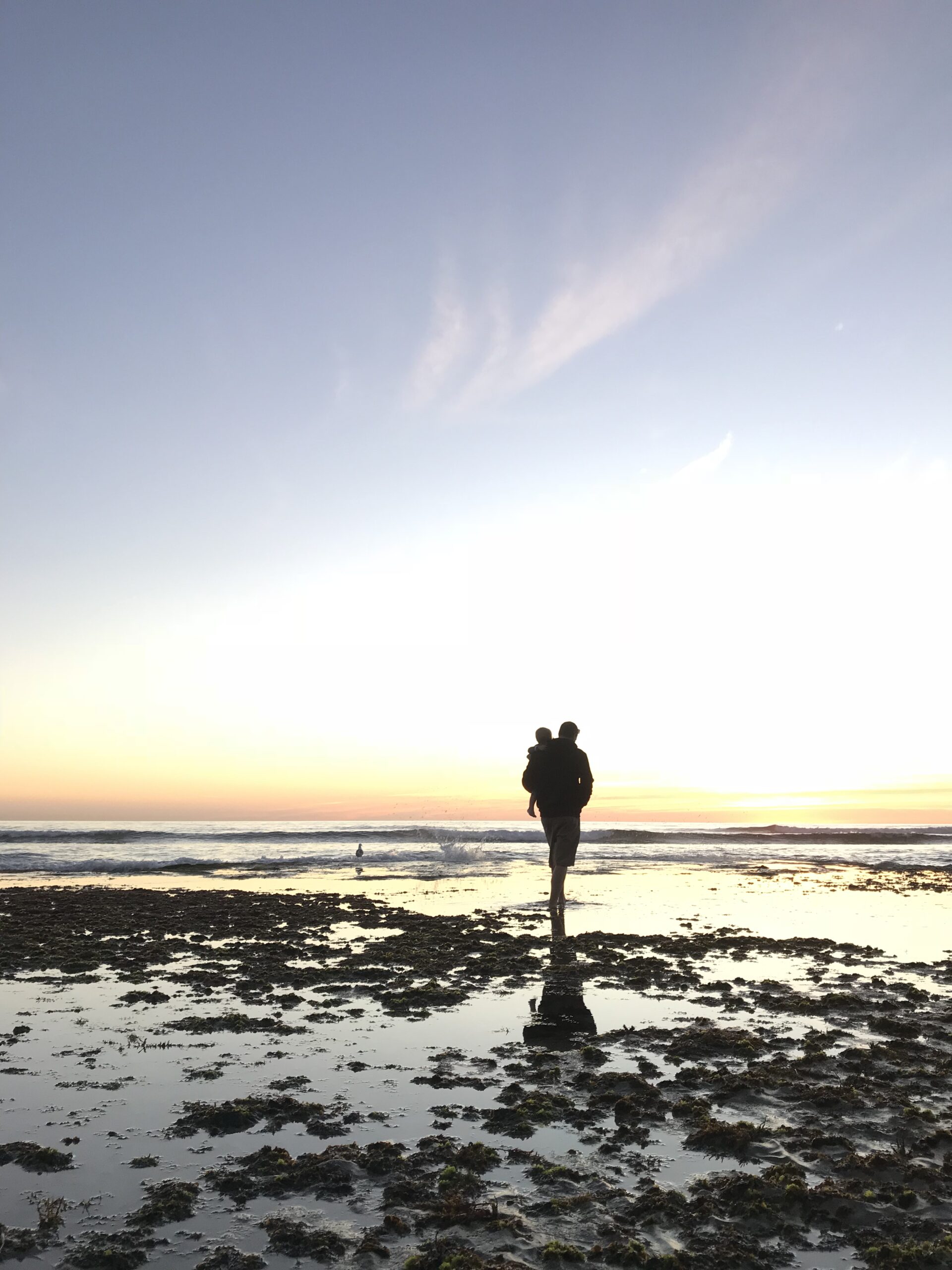 Dad with son at swamis. Connect with your kids over educational activities that are fun. 