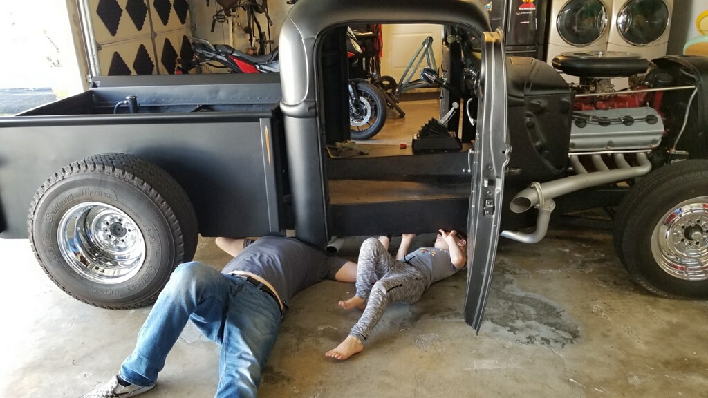 josh and son working on hotrod