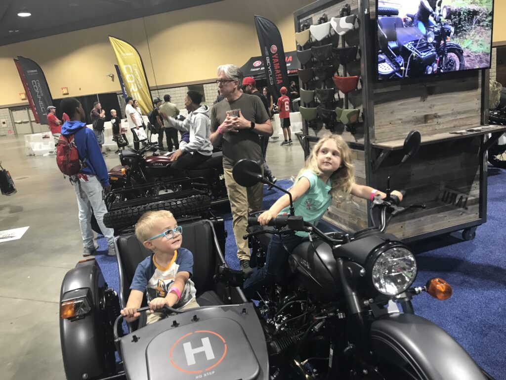 ParentingAdventures kids on Ural motorcycle with sidecar