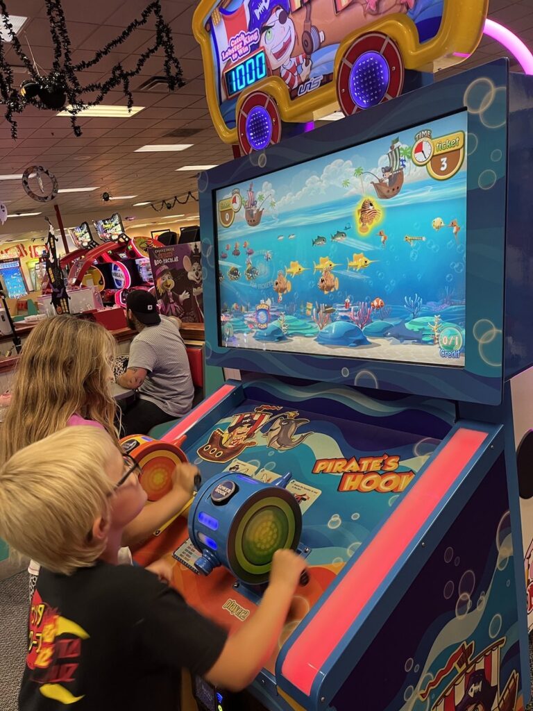 kids gaming on arcade